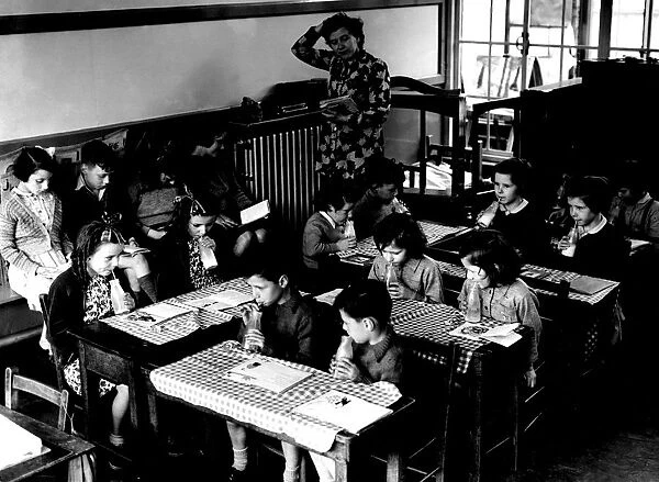 Children drinking milk at school. 1955