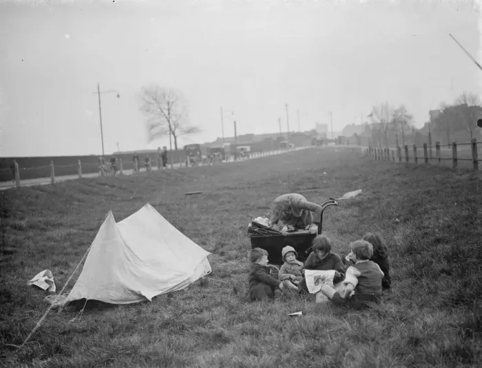 Framed Print : Children have a picnic on a bit of grass next to the road. 1938