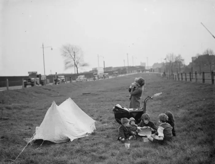 Framed Print : Children have a picnic on a bit of grass next to the road. 1938