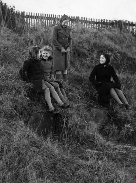 Framed Print : Children playing on the hill where flame bomb containers are still stored at Crowhurst