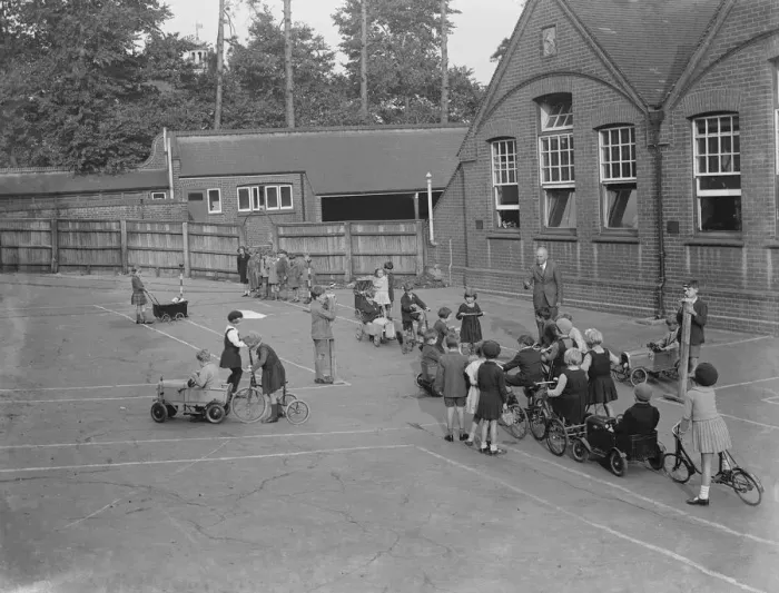 Framed Print : Children receive traffic instructions on the playground of their Sidcup Hill School
