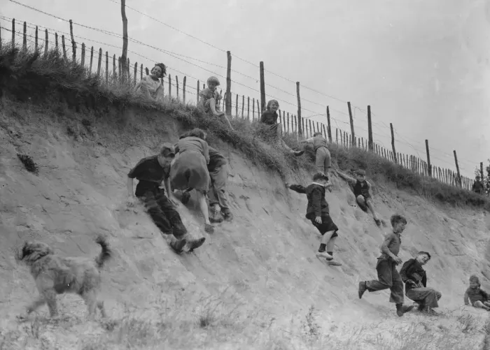 Framed Print : Children sliding down the bank. 1937 Framed Print : Children sliding down the bank. 1937