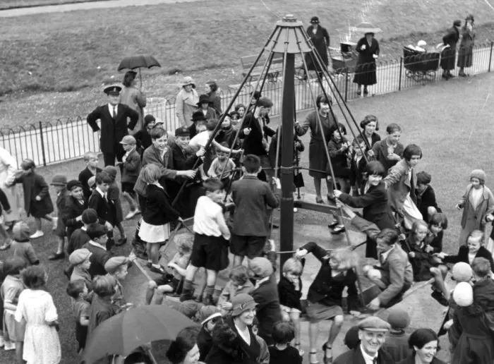 Framed Print : The childrens playground roundabout, a popular place for children after school