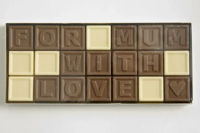 Framed Print : Chocolate letters spelling For Mum with love in cellophane box as Mothers day