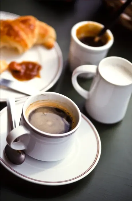 Framed Print : Coffee and croissant on cafe table in south of France credit: Marie-Louise Avery Framed Print : Coffee and croissant on cafe table in south of France credit: Marie-Louise Avery