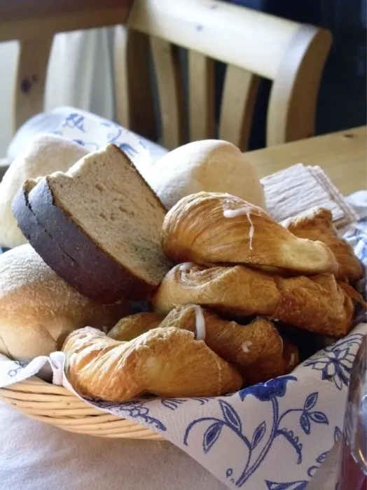 Framed Print : A collection of various breads and pastries in basket on table. Sweden credit