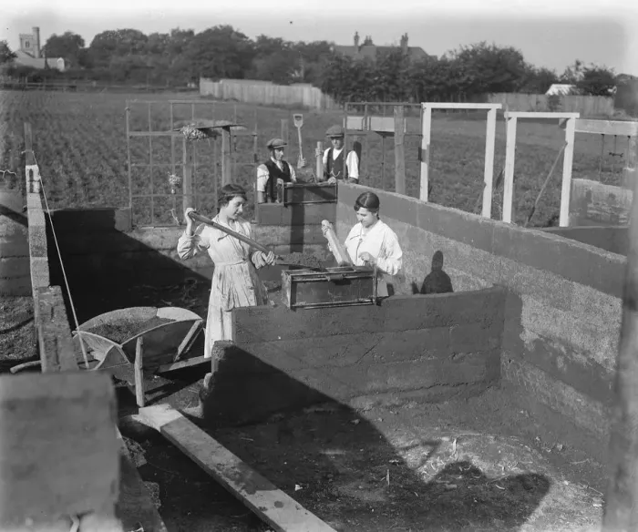 Framed Print : Concrete Houses at Harlow, Essex Girls filling the mould, in the background are Framed Print : Concrete Houses at Harlow, Essex Girls filling the mould, in the background are