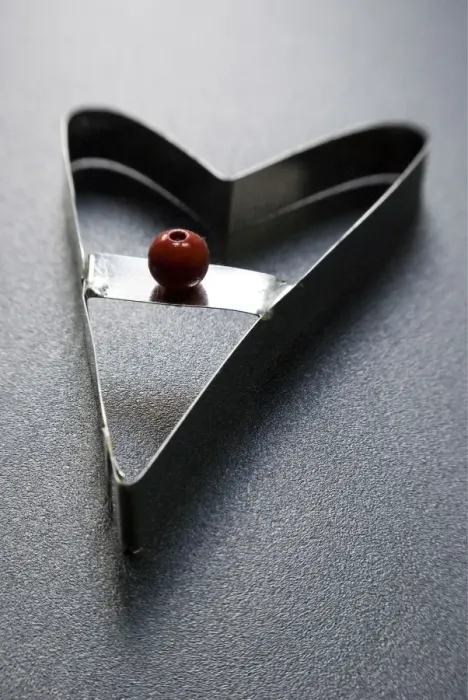 Framed Print : Cookie cutter in modern heart shape with red bead handle credit: Marie-Louise Avery Framed Print : Cookie cutter in modern heart shape with red bead handle credit: Marie-Louise Avery