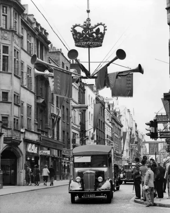 Framed Print : Coronation decorations go up and this shows something of the motie in Old Bond Street Framed Print : Coronation decorations go up and this shows something of the motie in Old Bond Street