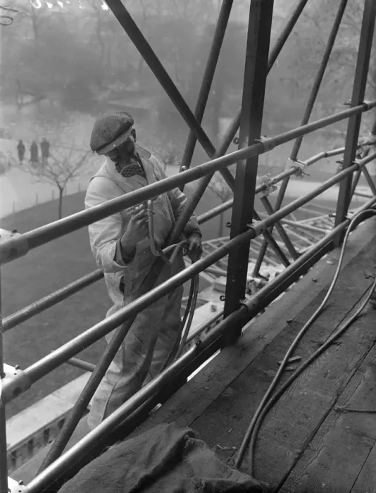 Framed Print : Coronation spray by masked workmen. A workman wearing a special mask as he sprays Framed Print : Coronation spray by masked workmen. A workman wearing a special mask as he sprays