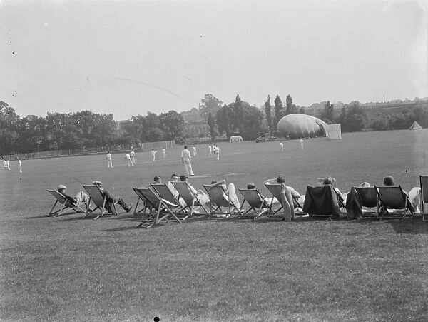 Cricket in Eltham, Kent. A barrage balloon can be seen in the background