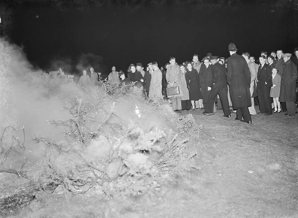 A crowd gathers at the site of a fire on Dartford Heath, Kent. 1939