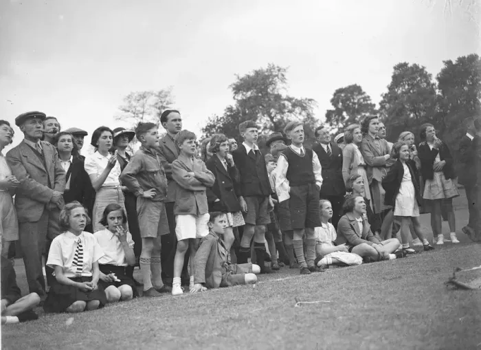 Framed Print : The crowd watching a trapeze artist performing at the Sidcup fete in Kent