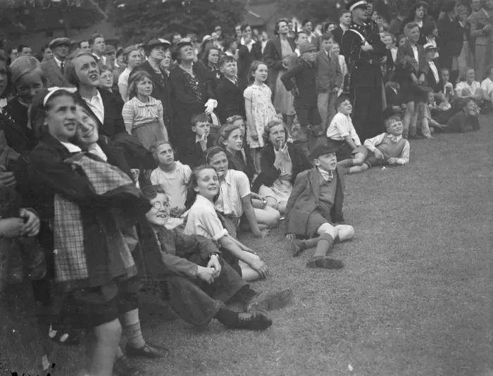 Framed Print : The crowd watching a trapeze artist performing at the Sidcup fete in Kent Framed Print : The crowd watching a trapeze artist performing at the Sidcup fete in Kent