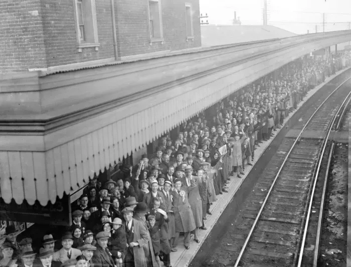 Framed Print : A crowded station platform full of Dartford supporters en route to the match between Framed Print : A crowded station platform full of Dartford supporters en route to the match between