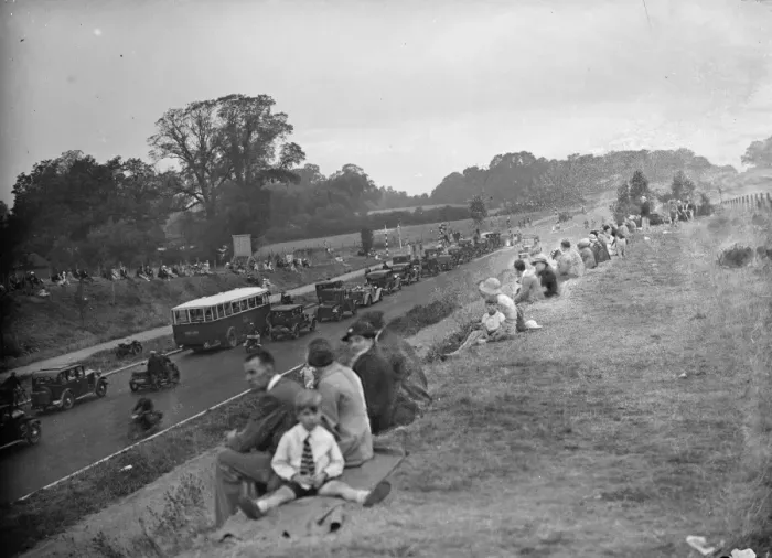 Framed Print : Crowds watching the traffic on the newly opened Sicup by - pass. The road greatly Framed Print : Crowds watching the traffic on the newly opened Sicup by - pass. The road greatly