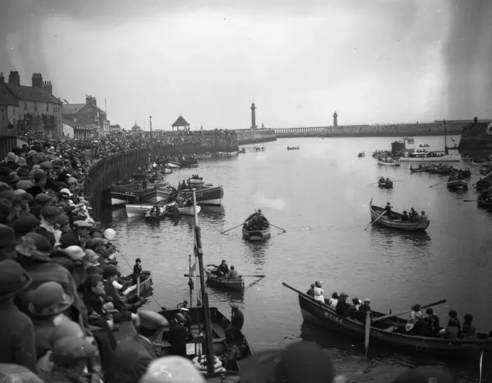Framed Print : Crowds at Whitby harbour watching the rowing boats on the River Esk, Yorkshire Framed Print : Crowds at Whitby harbour watching the rowing boats on the River Esk, Yorkshire