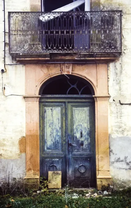 Framed Print : Crumbling, dilapidated entrance doorway and balcony of old French maison de maitre