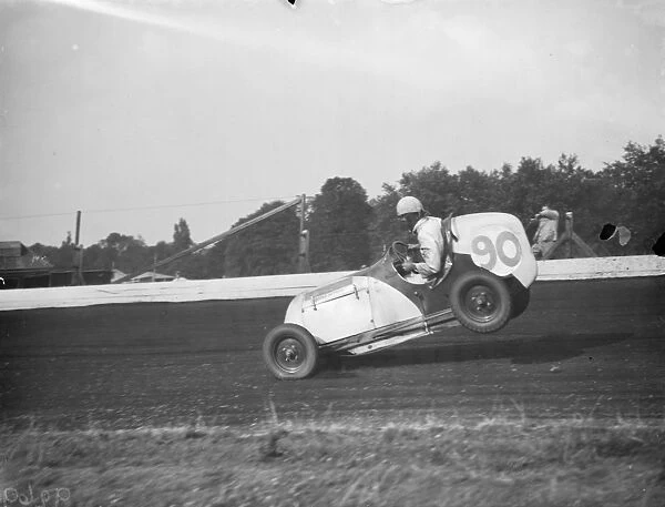 The Crystal Palace miniature car racing grand prix. Frank Chiswell lifts the rear