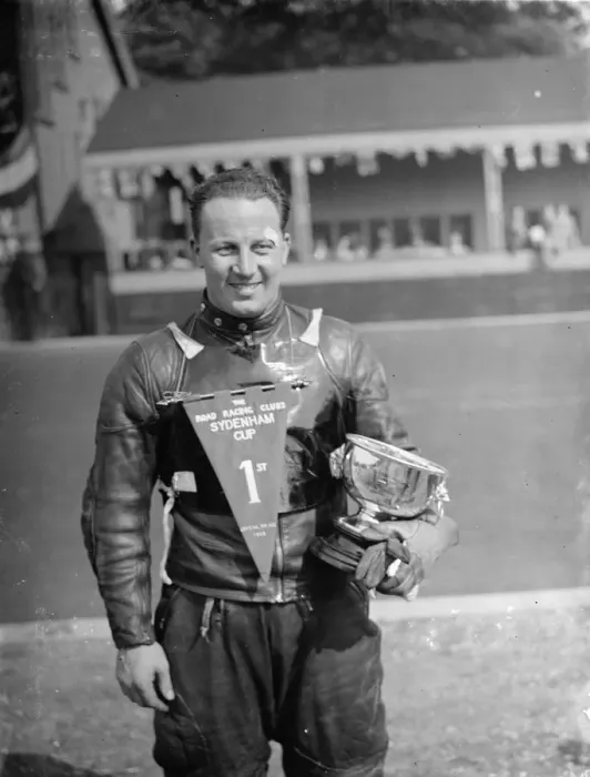 Framed Print : The Crystal Palace Road Racing. J H T Smith, the racing car driver, poses with his trophy Framed Print : The Crystal Palace Road Racing. J H T Smith, the racing car driver, poses with his trophy