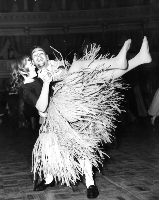 Framed Print : Dancing to rock and roll wearing a grass skirt dance / dancing / party season Framed Print : Dancing to rock and roll wearing a grass skirt dance / dancing / party season
