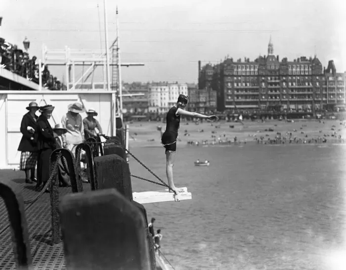 Framed Print : Diving off the pier during the Whitsun holiday at Brighton. 1920 Framed Print : Diving off the pier during the Whitsun holiday at Brighton. 1920