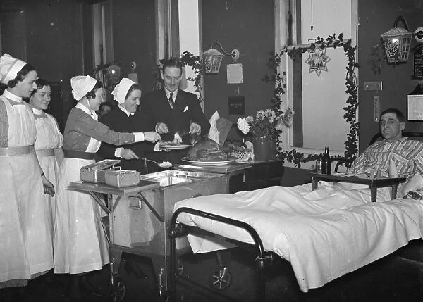 Doctor Sinclair carving the Christmas turkey for the patients on the ward at Erith