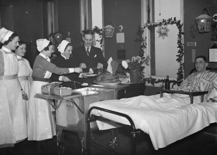 Framed Print : Doctor Sinclair carving the Christmas turkey for the patients on the ward at Erith Framed Print : Doctor Sinclair carving the Christmas turkey for the patients on the ward at Erith