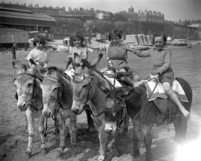 Framed Print : Donkeys on the sands at Ramsgate beach with their happy young riders. 22 May 1926