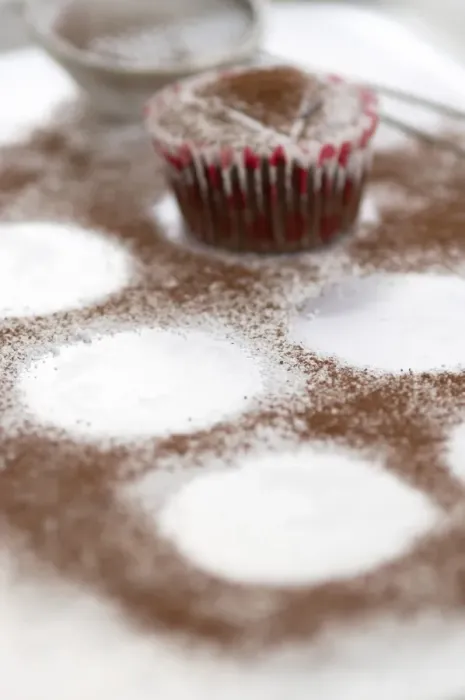 Framed Print : Dusting chocolte muffins with cocoa powder credit: Marie-Louise Avery  /  thePictureKitchen