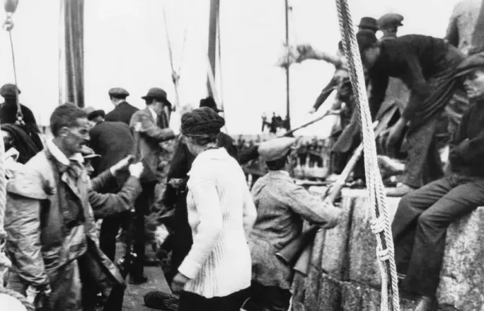 Framed Print : Erskine Childers (in oilskins) as arms landed from the Asgard at Howth in 1914 Aboard Framed Print : Erskine Childers (in oilskins) as arms landed from the Asgard at Howth in 1914 Aboard