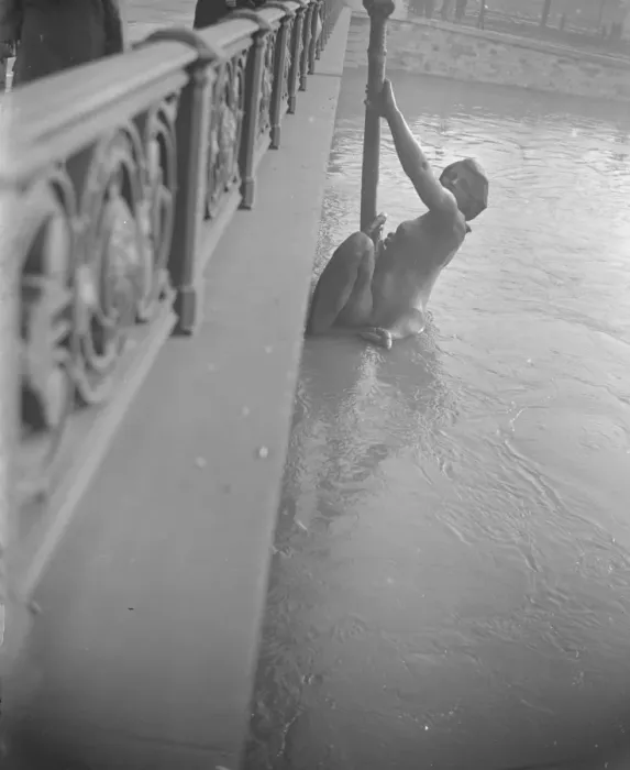 Framed Print : Escaping from the floods. The huge bronze figure on the Pont Mirabeau would Framed Print : Escaping from the floods. The huge bronze figure on the Pont Mirabeau would