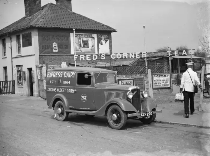 Framed Print : A Express Dairy Delivery Bedford van from London, makes a delivery to Freds Corner