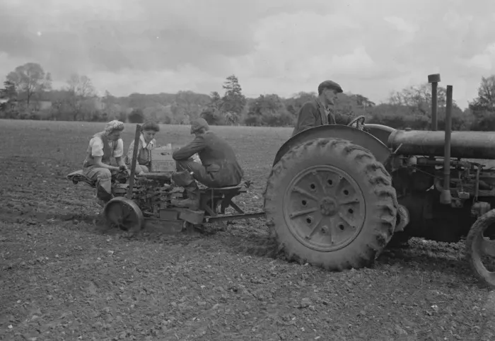 Framed Print : Farm workers using a tracter drawn Transplanters Robot Ltd crop planter