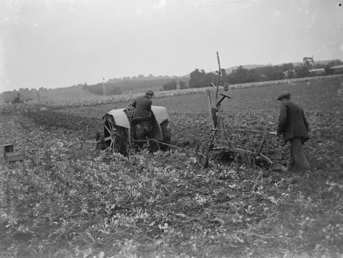 Framed Print : A farmer and his tractor plough a field. 1935 Framed Print : A farmer and his tractor plough a field. 1935