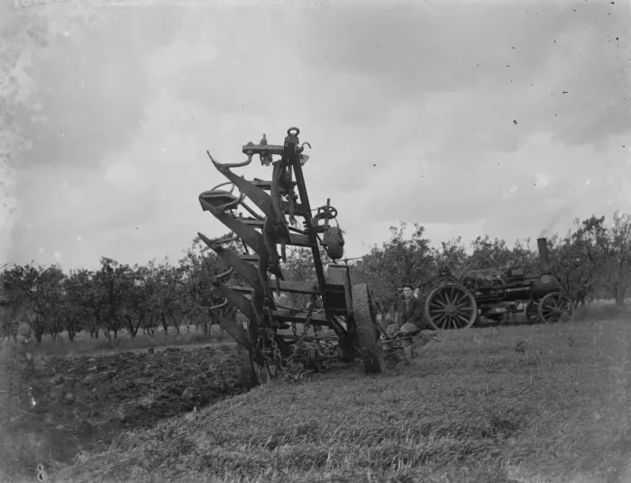 Framed Print : A farmer uses a steam engine to plough a field. 1935