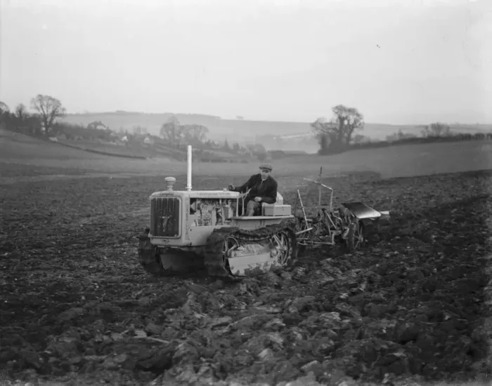 Framed Print : A farmer using his diesel caterpillar tractor to plough a field in Farningham, Kent Framed Print : A farmer using his diesel caterpillar tractor to plough a field in Farningham, Kent