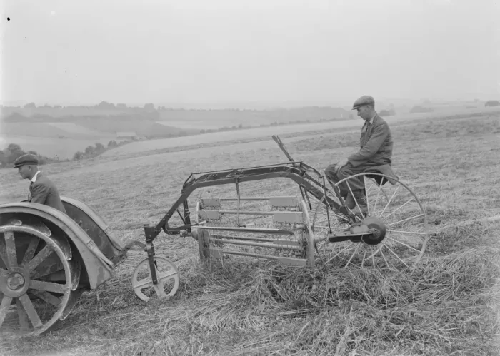 Framed Print : Farmers using a new tractor drawn haymaking machine on a field in Farningham, Kent