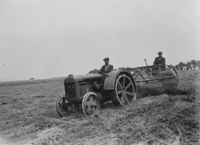 Framed Print : Farmers using a new tractor drawn haymaking machine on a field in Farningham, Kent Framed Print : Farmers using a new tractor drawn haymaking machine on a field in Farningham, Kent