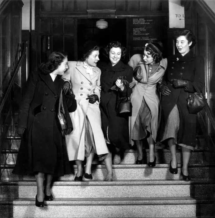 Framed Print : Female clerks, staff from Woman magazine, leaving the office, London, England Framed Print : Female clerks, staff from Woman magazine, leaving the office, London, England