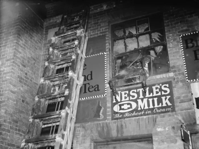 Framed Print : The fire brigade dealing with a fire at a Foots Cray shop in Kent. A ladder up