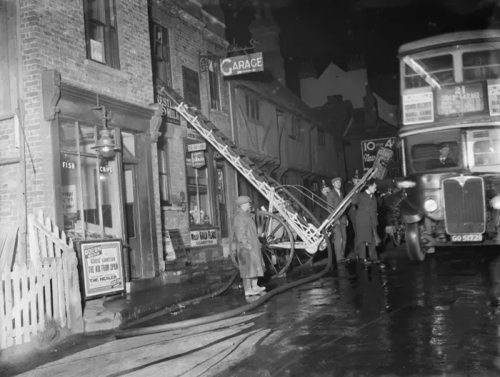 Framed Print : The fire brigade dealing with a fire at a Foots Cray shop in Kent A ladder up Framed Print : The fire brigade dealing with a fire at a Foots Cray shop in Kent A ladder up