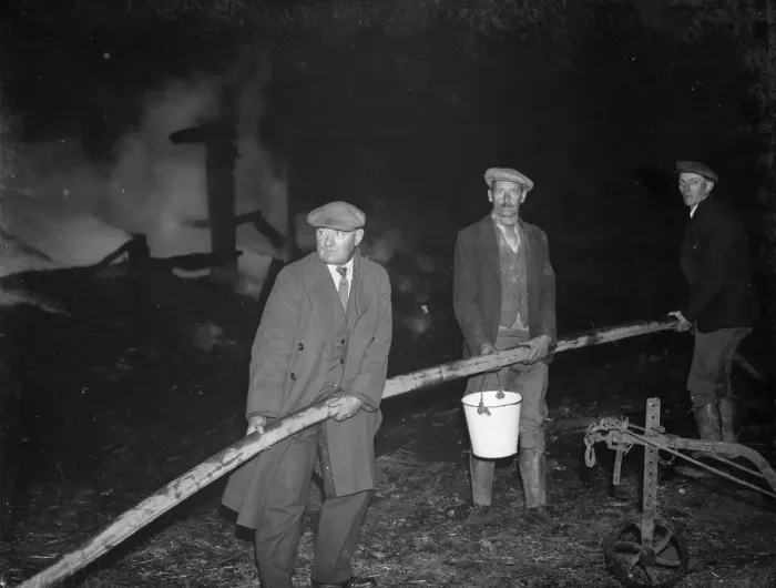 Framed Print : A fire at Chaplins Farm, Hockenden. Farm workers hold the hoses