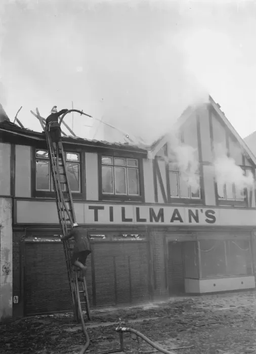 Framed Print : Firemen attempt to put out fires in a parade of shops in Welling, Kent Framed Print : Firemen attempt to put out fires in a parade of shops in Welling, Kent