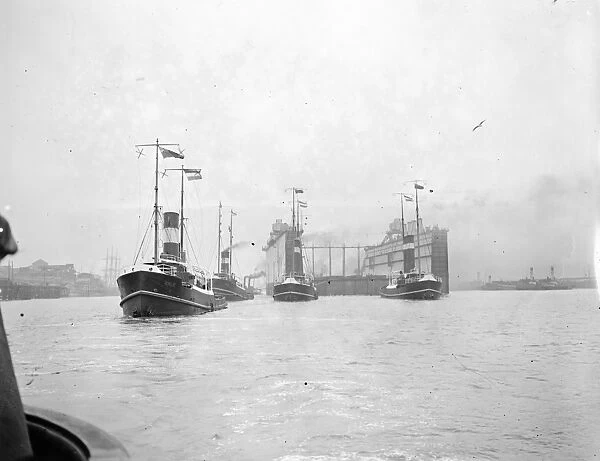 The first half of the new floating dock for Singapore leaving the Tyne 21 June 1928
