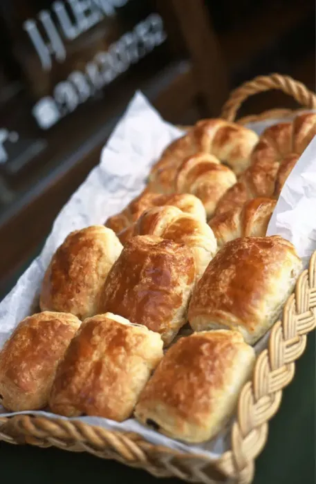 Framed Print : Freshly baked pains au chocolat outside French patisserie, JJ Lenoir, in Valbonne