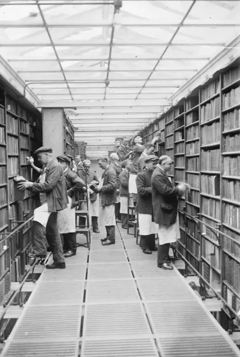 Framed Print : The gentlemen with the dusters. Millions of books being overhauled at the British Framed Print : The gentlemen with the dusters. Millions of books being overhauled at the British