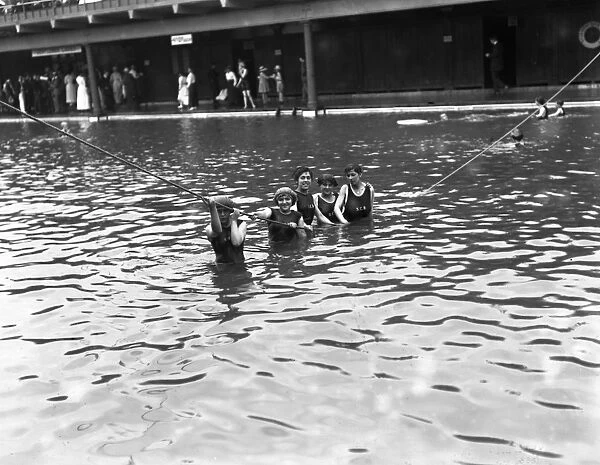Girl bathers in the open - air swimming pool at Westcliff - on - Sea, Essex