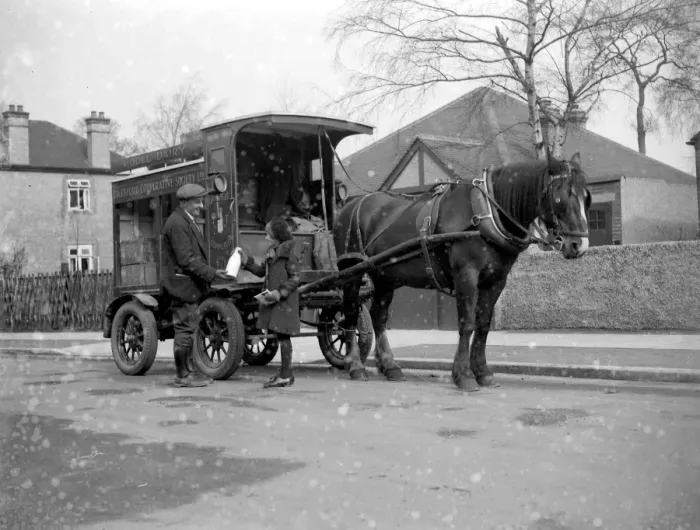 Framed Print : Girl buying milk from a milkman beside his milk van of the Dartford Cooperative Society Framed Print : Girl buying milk from a milkman beside his milk van of the Dartford Cooperative Society