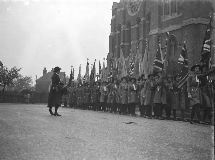 Framed Print : Girl guides during their church parade in front of the Parish Church of St John Framed Print : Girl guides during their church parade in front of the Parish Church of St John